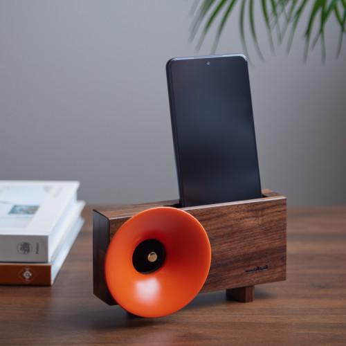 wooden amplifier for smartphones. made from american hardwood with a orange coloured gramophone speaker detail on the left hand side.    