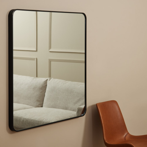 square mirror with a black metal border